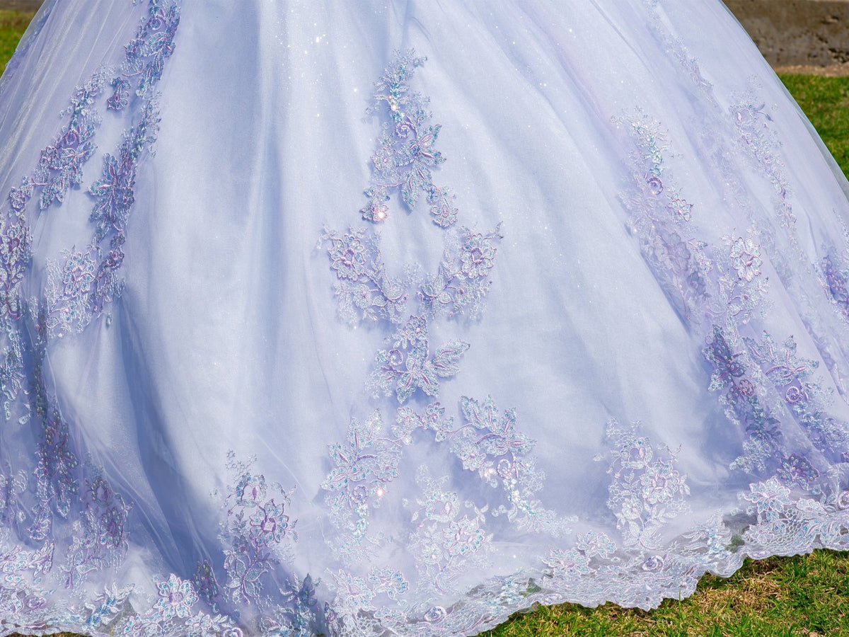 Intricate features stand out across a lilac two-tone quinceanera ball gown with floral embroidery and layered tulle fabric.
