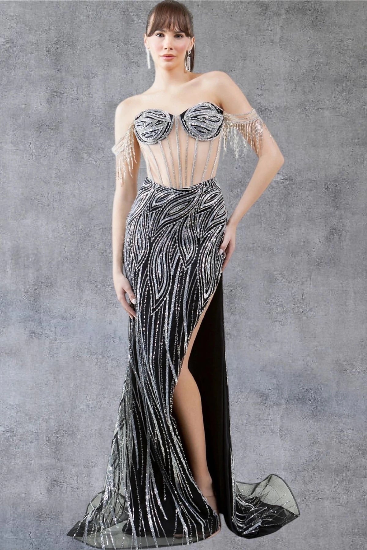 Textured details appear across black prom dress showcasing fitted skirt with silver beadwork patterns.