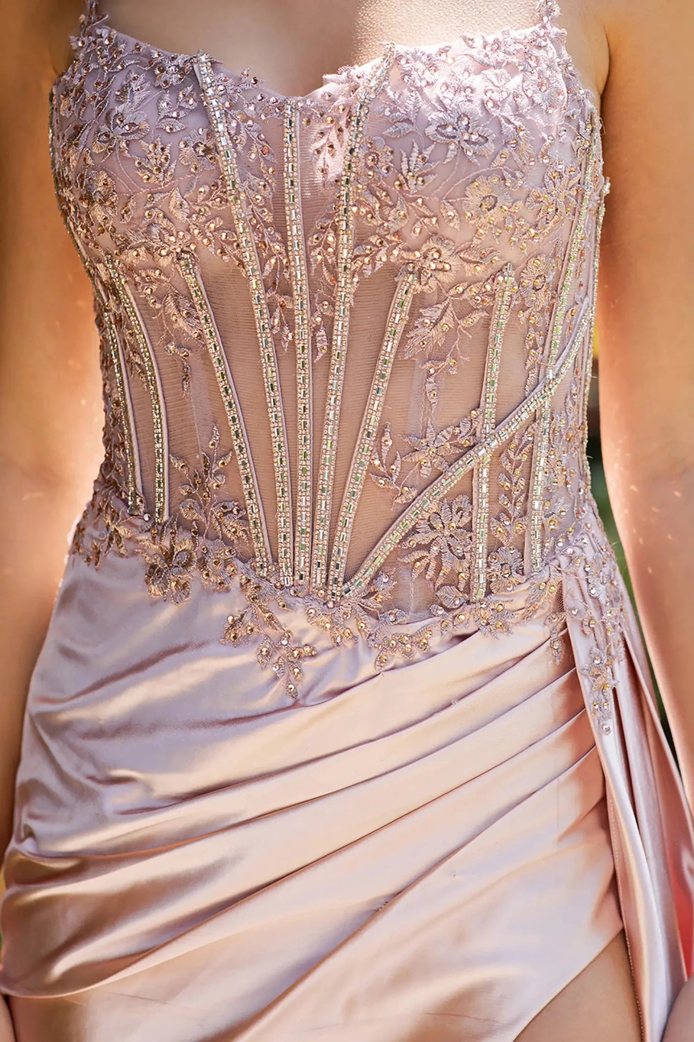 Close-up of pink floral lace bodice with bead embellishments.