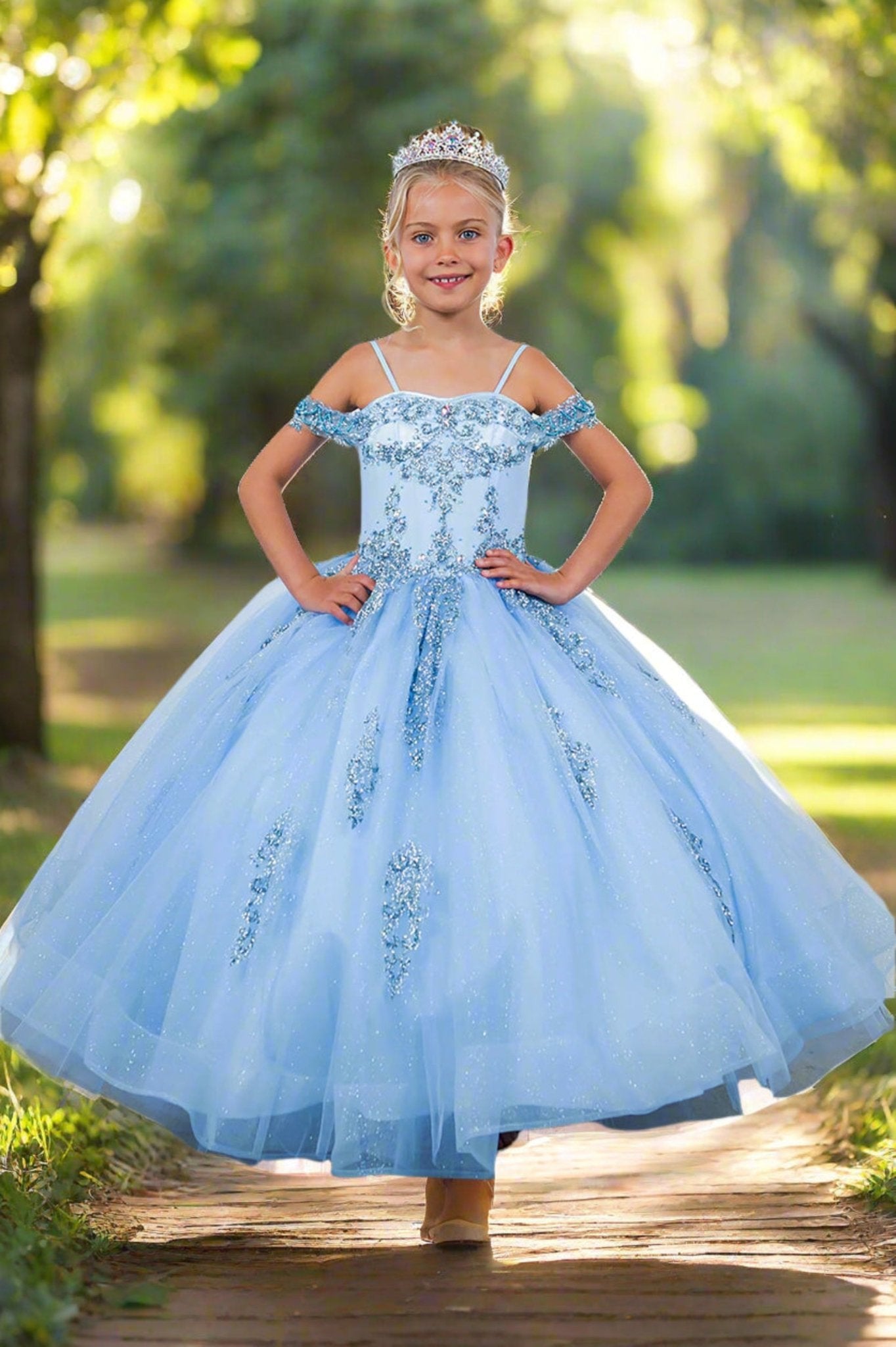 Blue front view kids mini quinceañera mini quince dress with sparkle bead details and layered tulle skirt.