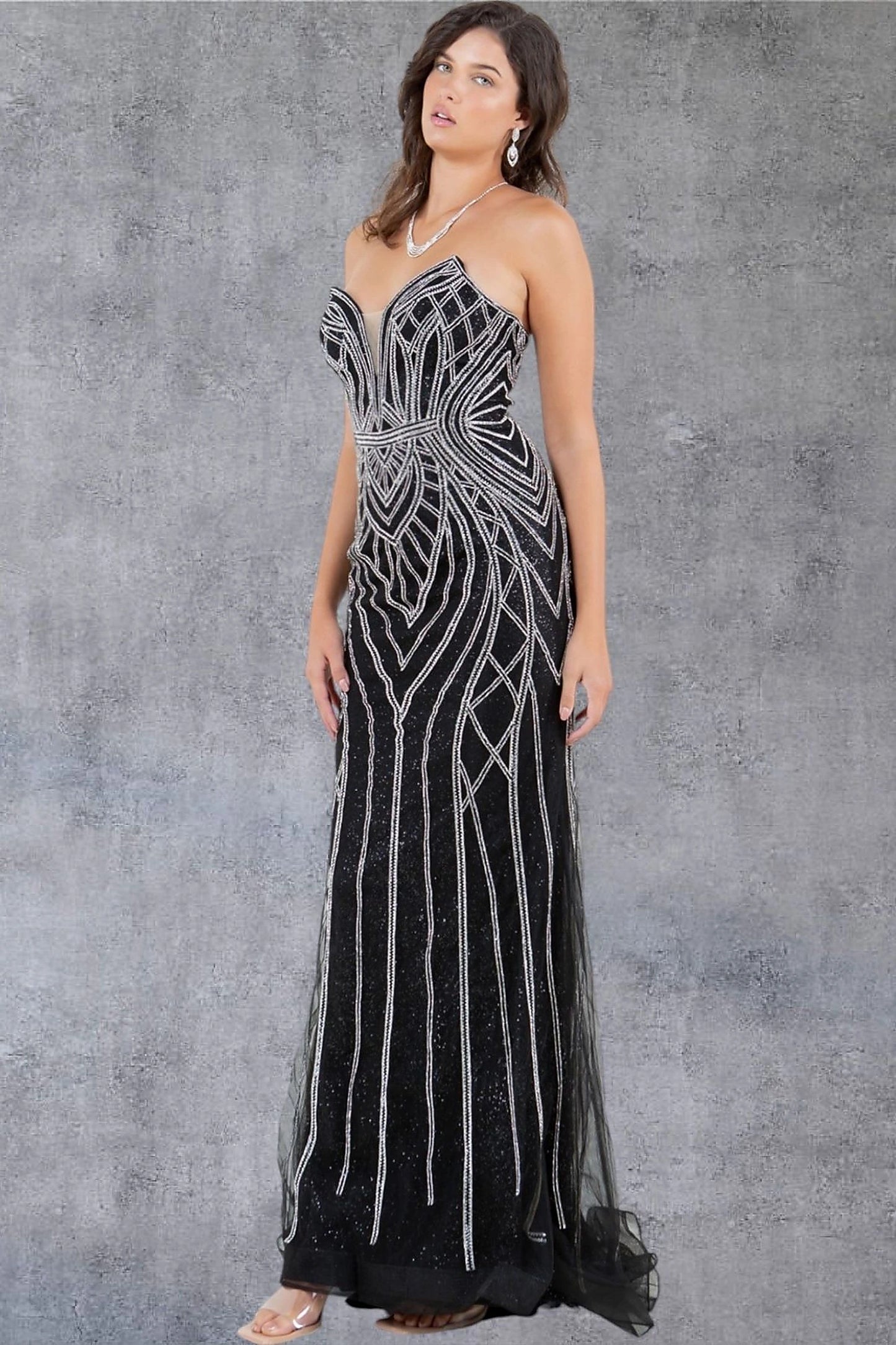 Black evening dress styled with form-fitting silhouette accentuating waist