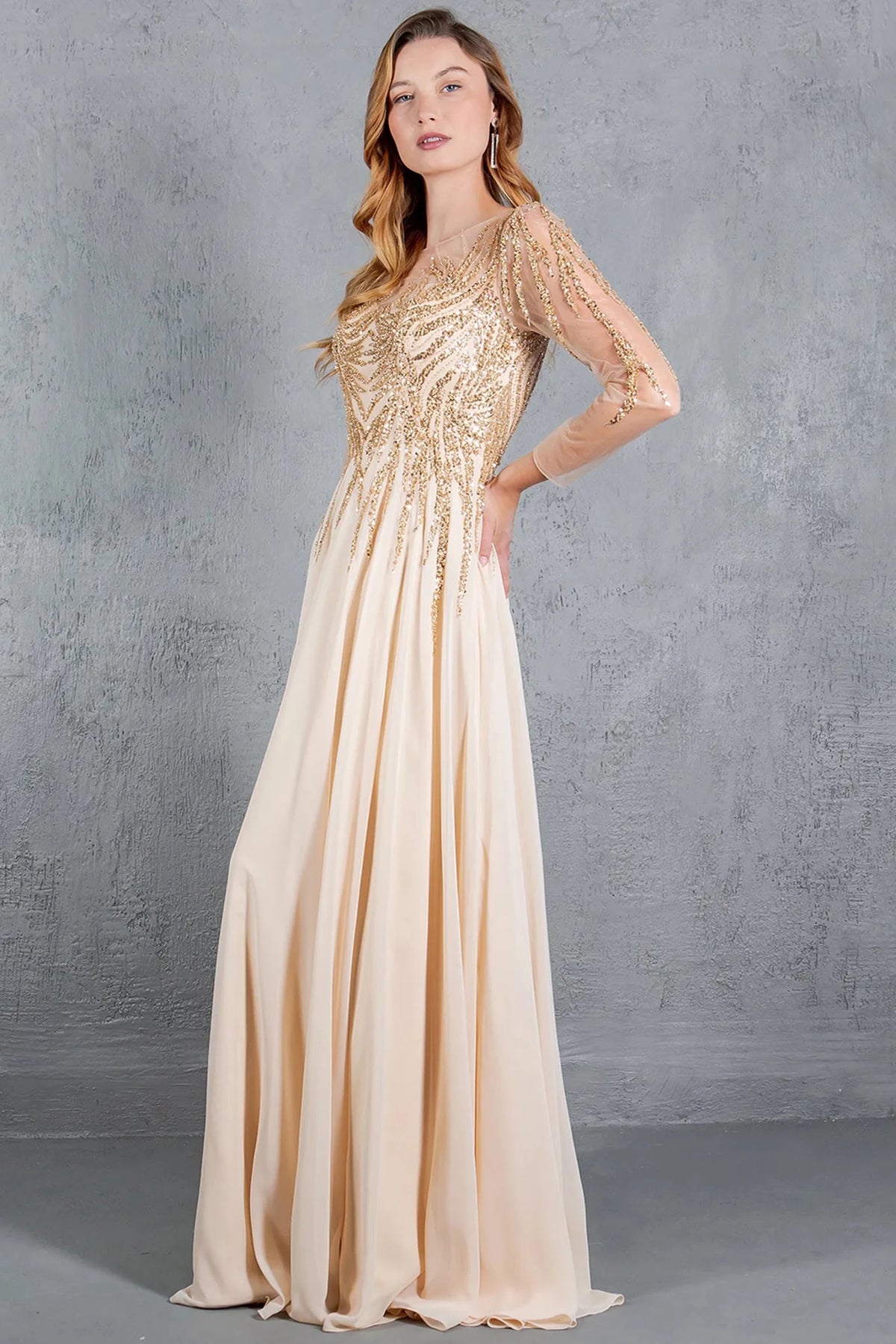 Luminous Champagne chiffon mother of the bride A-line dress presents a beaded illusion neckline.