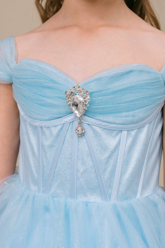 close up the top of sky blue dress and rhinestone center