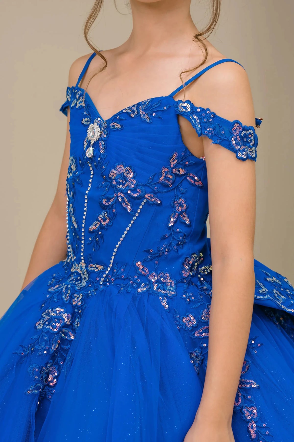 Decorative elements define close-up Royal mini quince off shoulder mini quince dress with embroidered bodice, gemstone accent.
