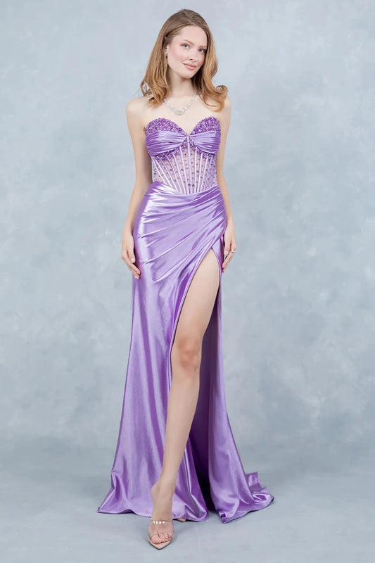 A full-length view of a woman wearing lilac prom dress designed with a lace-up corset and elegant train.