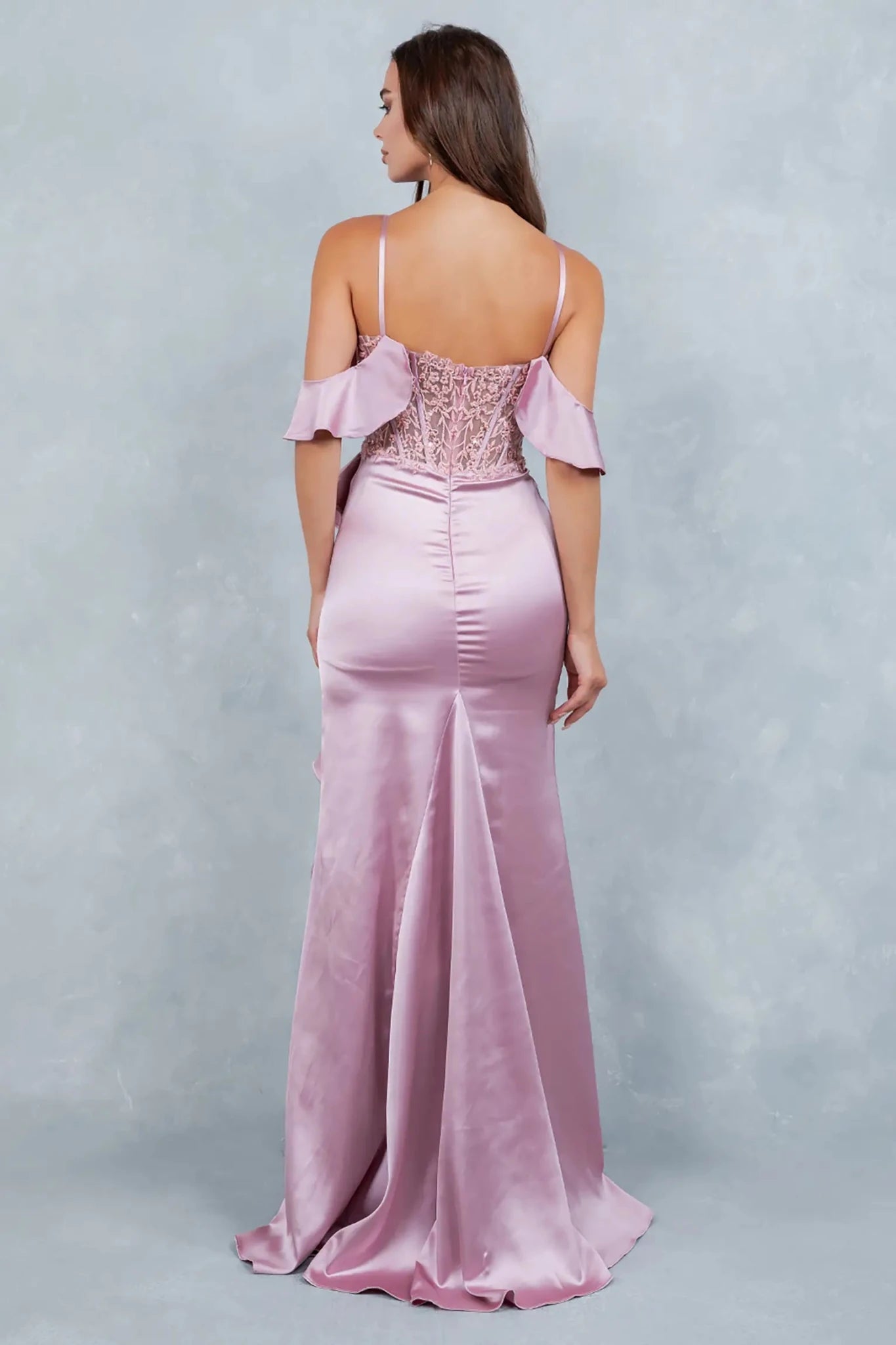 Full back view of rose gold formal dress with elegant flowing train.