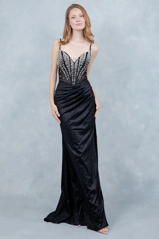 A full-length view of a woman wearing black glitter formal dress with a lace-up corset.