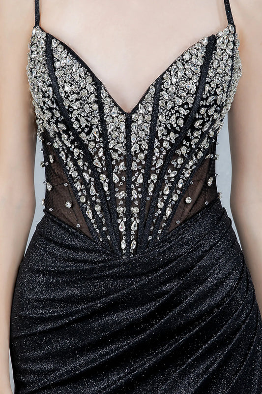Black evening gown featuring strapless V-neckline bodice with crystal beading