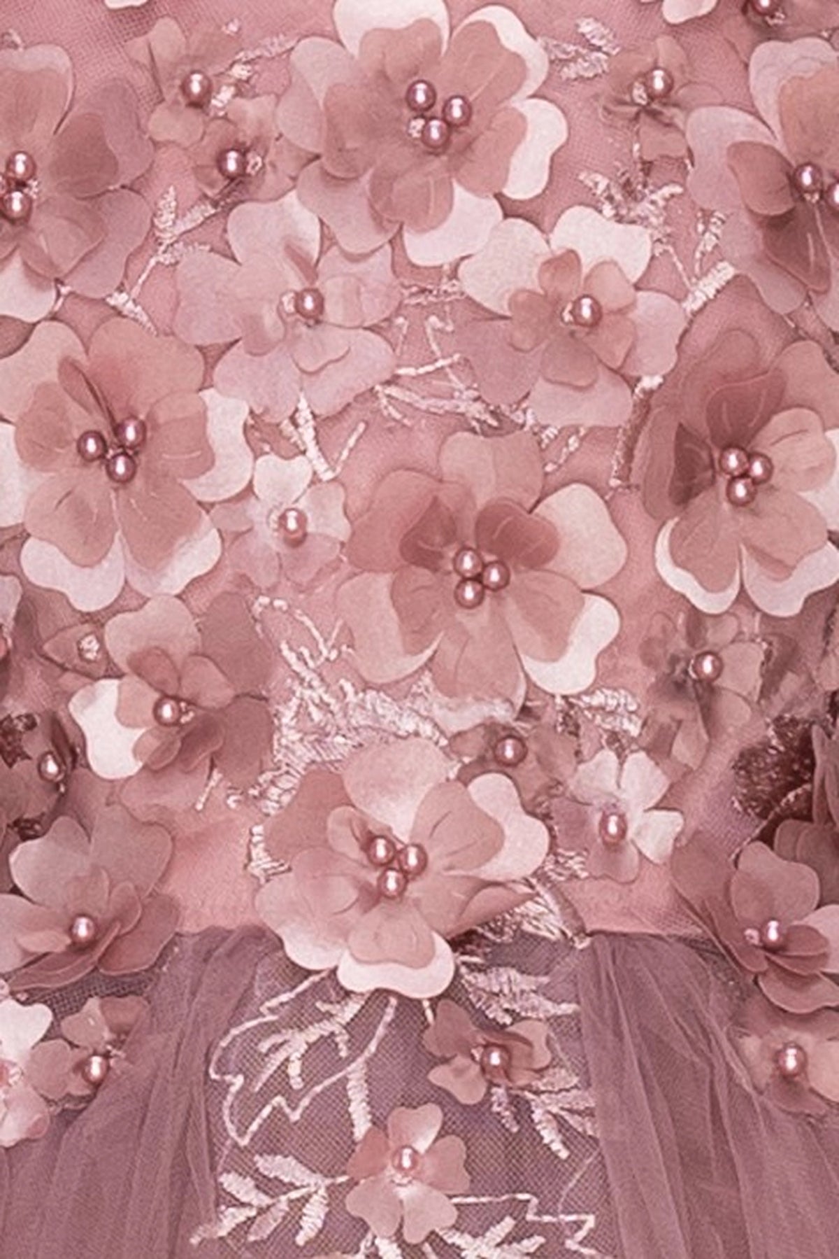Finished details of three-dimensional flowers on the bodice distinguish the Mauve kids party dress.