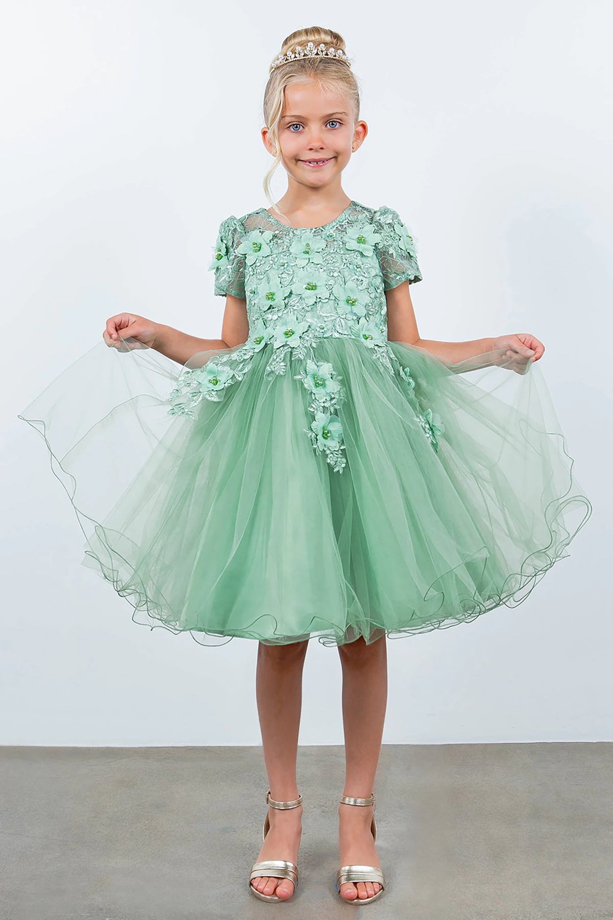 A Sage floral flower girl dress.