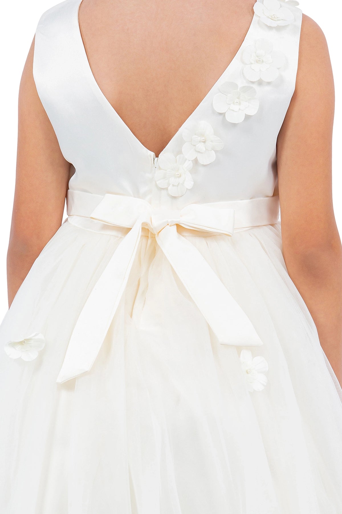 Featuring satin bow beside the floral back trim on the Ivory flower girl dress.