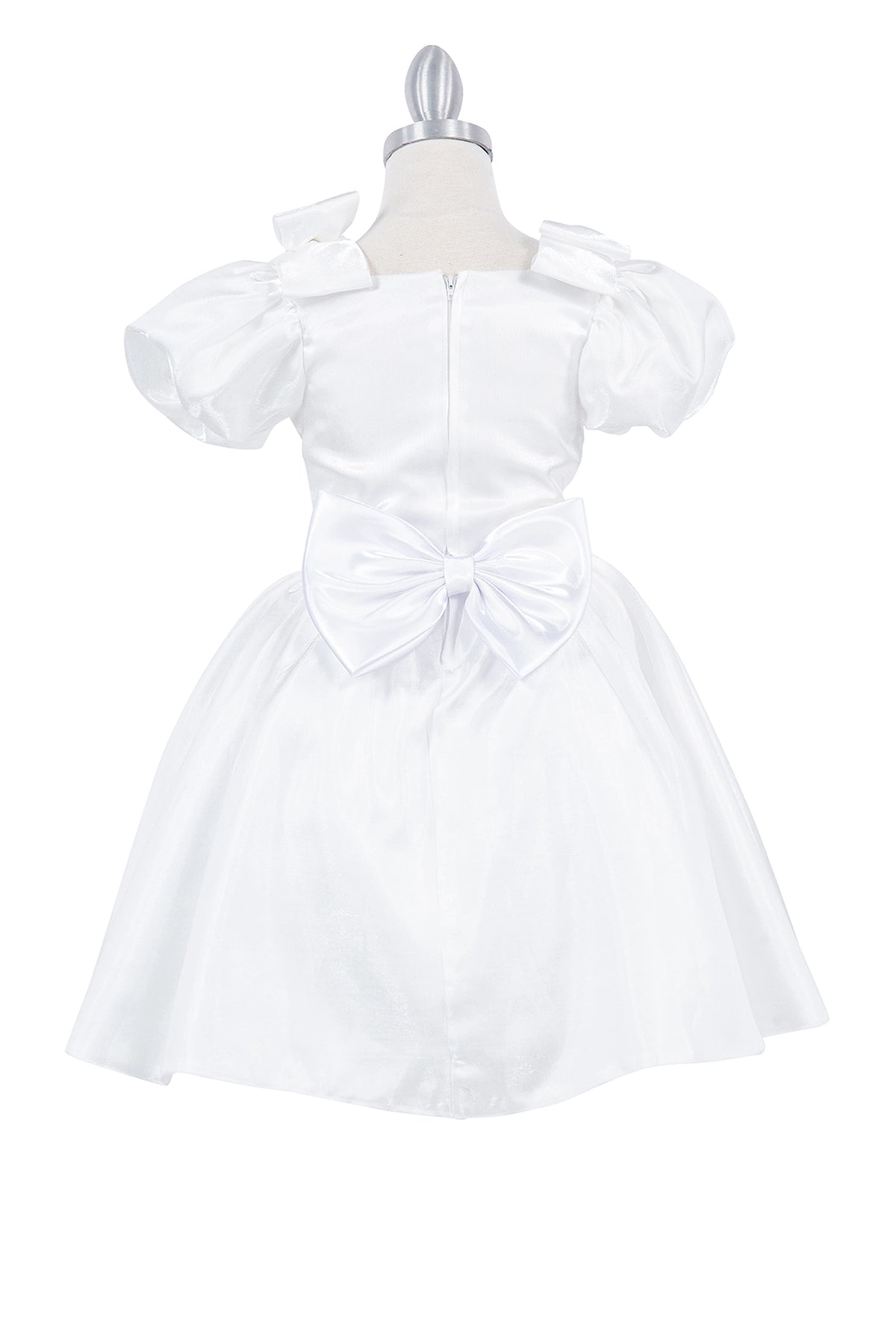 A Ivory flower girl dress showing back bow and zipper on the satin bodice.