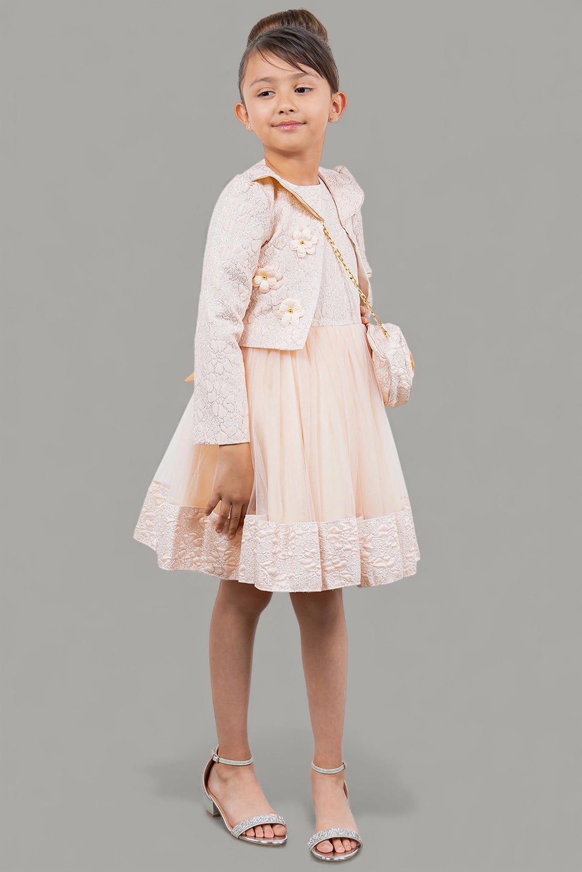 Featuring with a cropped matching jacket, this Pink kids party dress displays elegant detail.