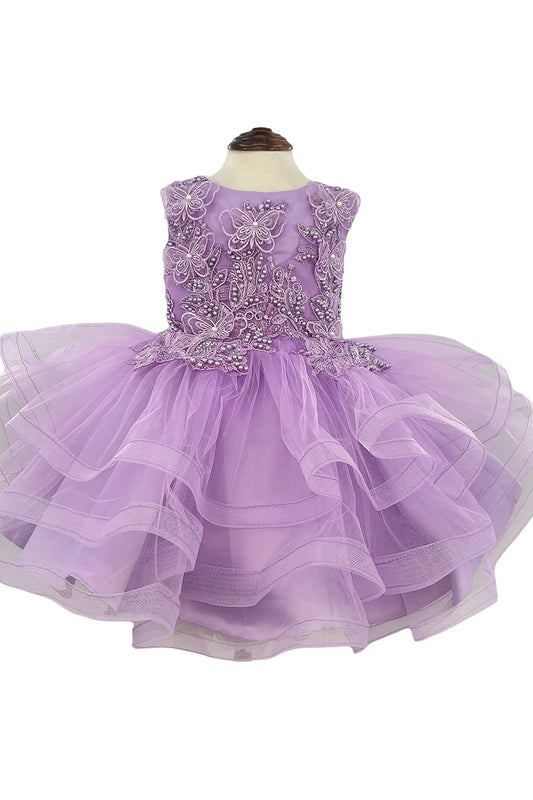 Lavender dress with beaded top and butterfly, floral appliques on a white background