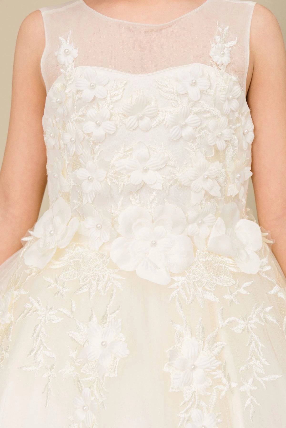 Visible on this Ivory flower girl dress: dimensional flowers across the sheer-yoke bodice.