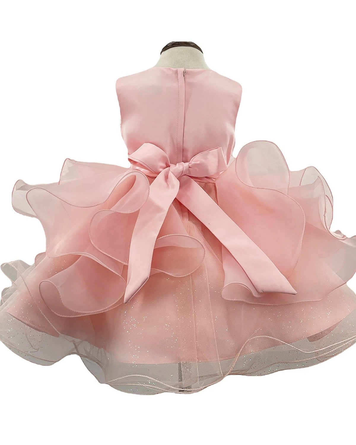 Pink flower girl dress with a large bow.