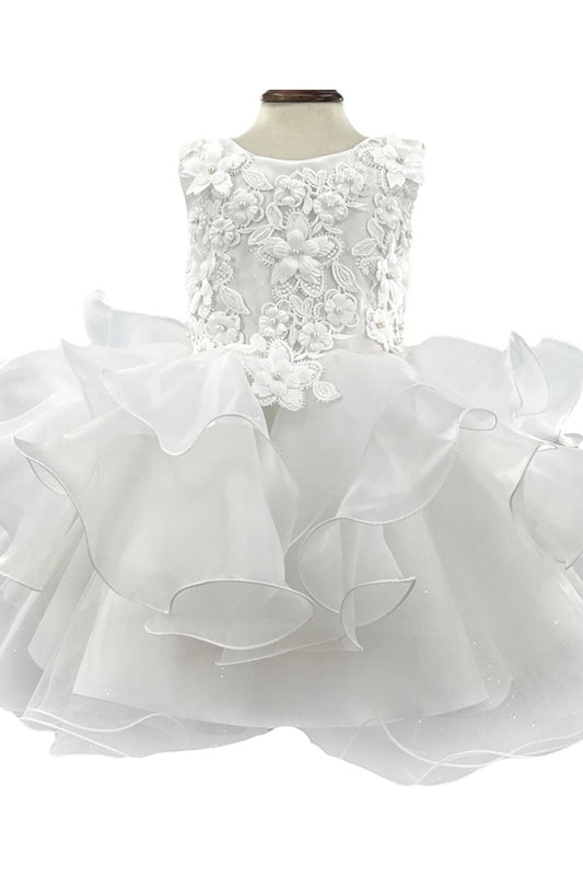 White flower girl dress with lace top and ruffled skirt on a mannequin against a white background