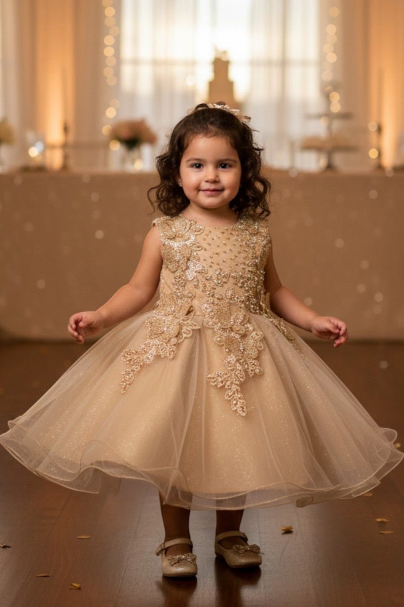 Gold flower girl Dress Front View With Layered Skirt And Oversized Bow Detail.