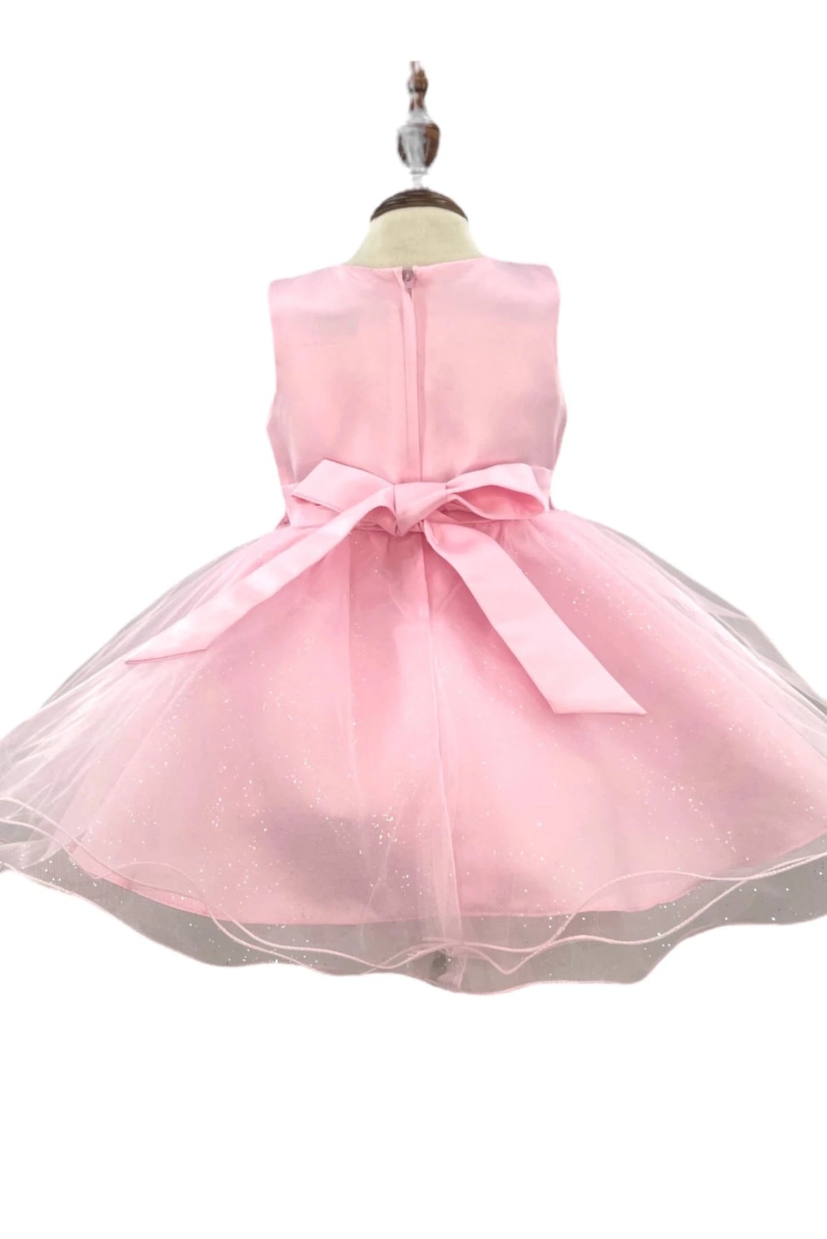 An oversized satin bow highlights the zippered back of the Pink flower girl baby dress.