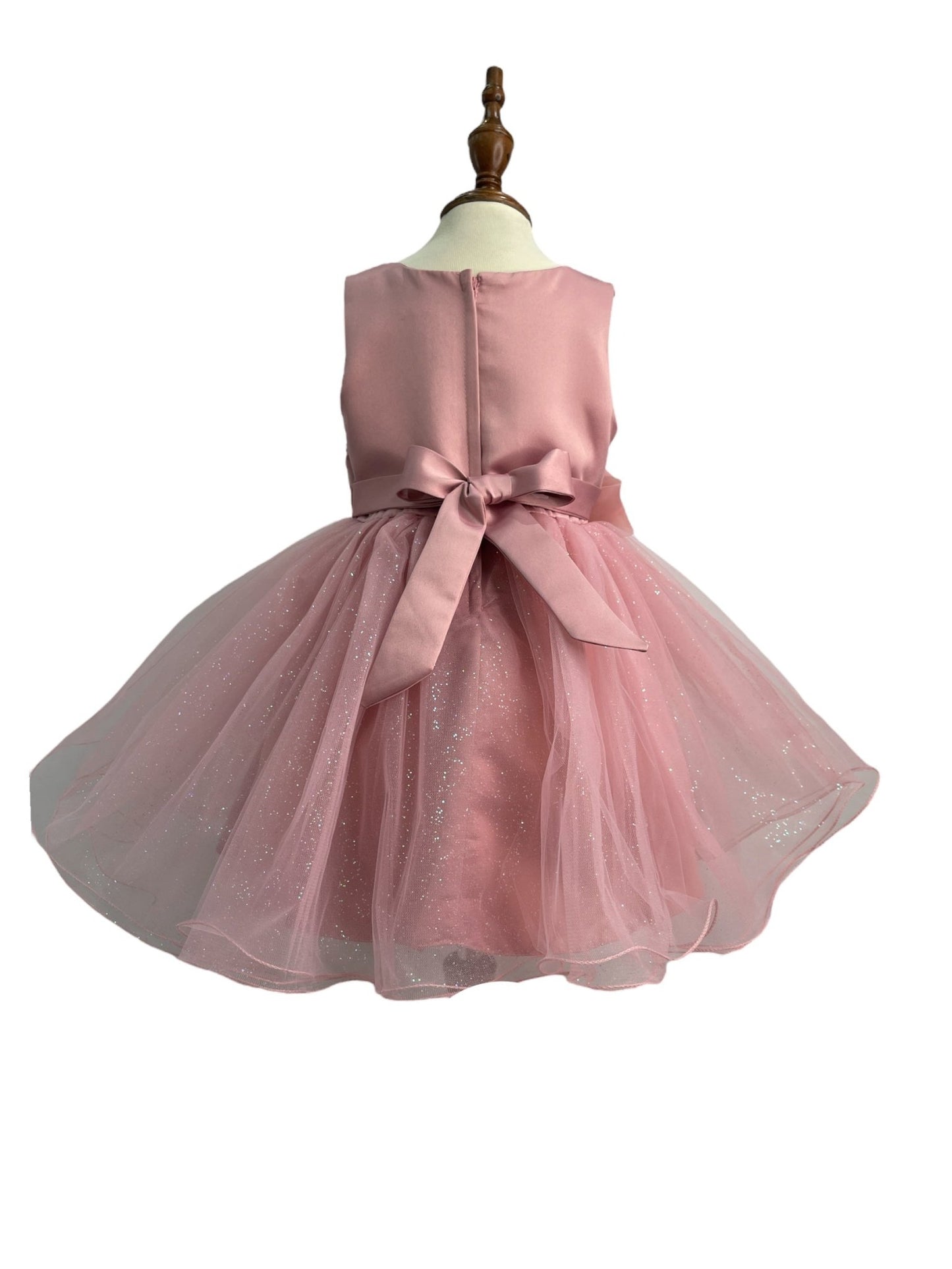 Dusty rose dress back view highlighting full skirt and elegant silhouette