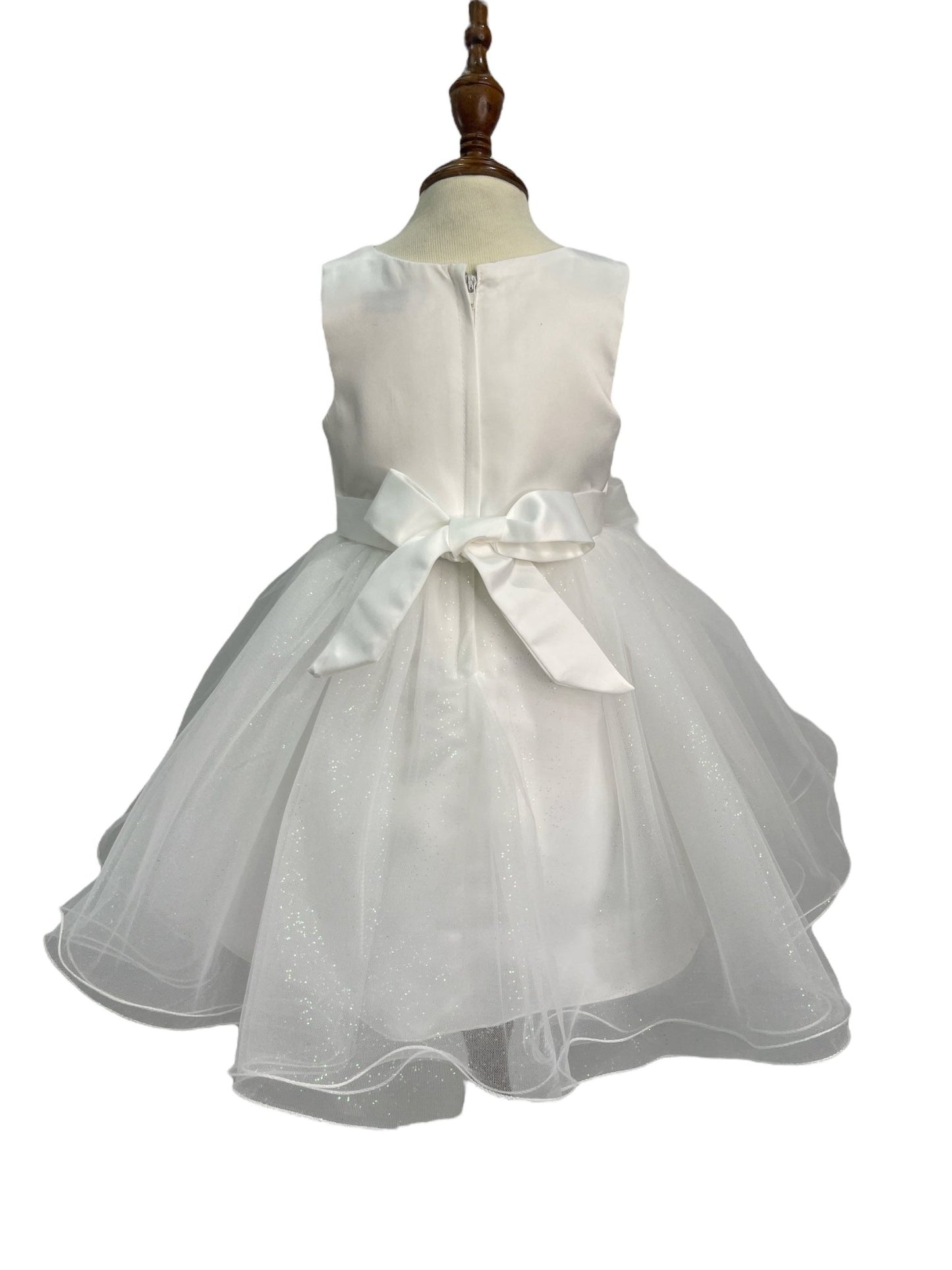 White dress back view highlighting full skirt and elegant silhouette