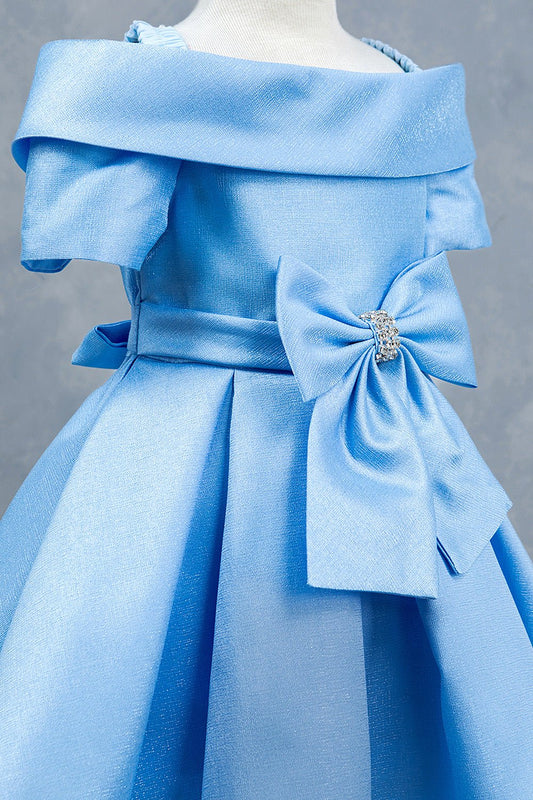 Close-up front view of blue dress showing rhinestone bow detail and collar