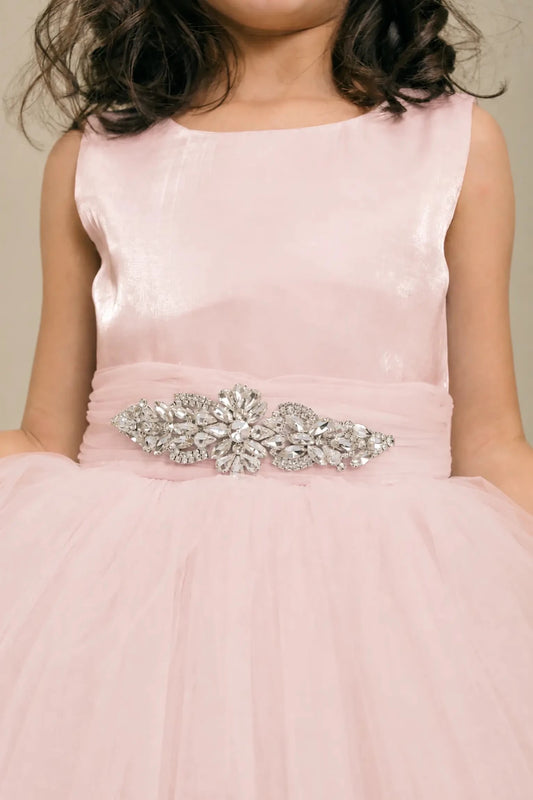 Blush flower girl dress with rhinestone waistband, satin bodice, and glitter tulle skirt