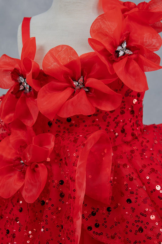 Close-up front view of red dress showing crystal floral detail and sequin texture