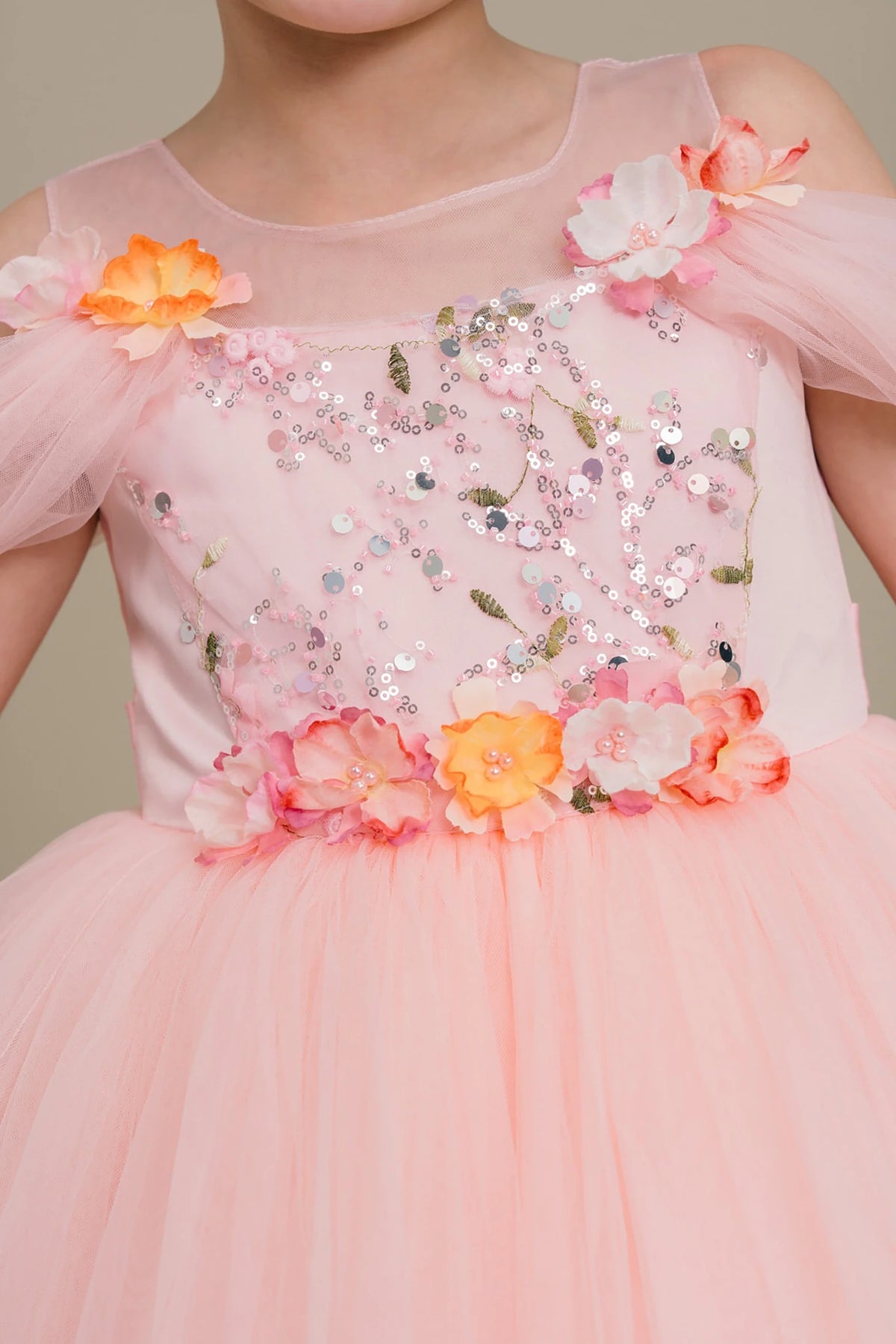Pink flower girl dress with floral embellishments.