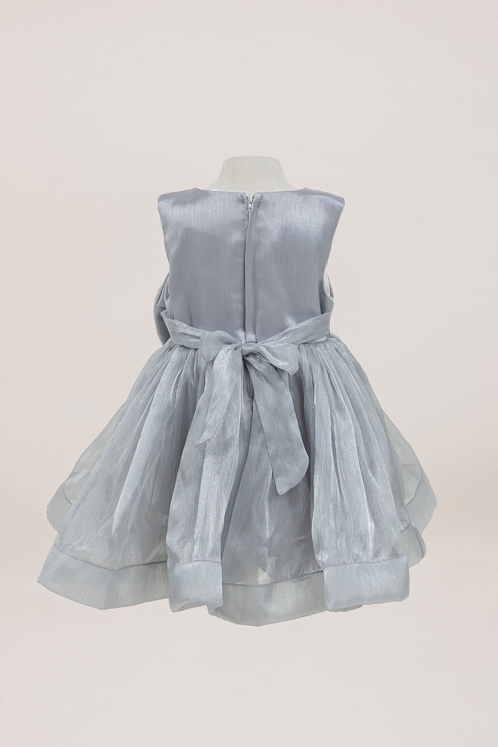 Silver flower girl dress back view highlighting full skirt and elegant silhouette.