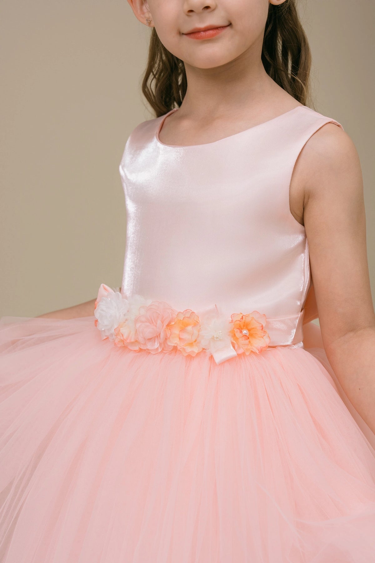 Visible on this Blush flower girl dress: raised waist flowers on the satin bodice.
