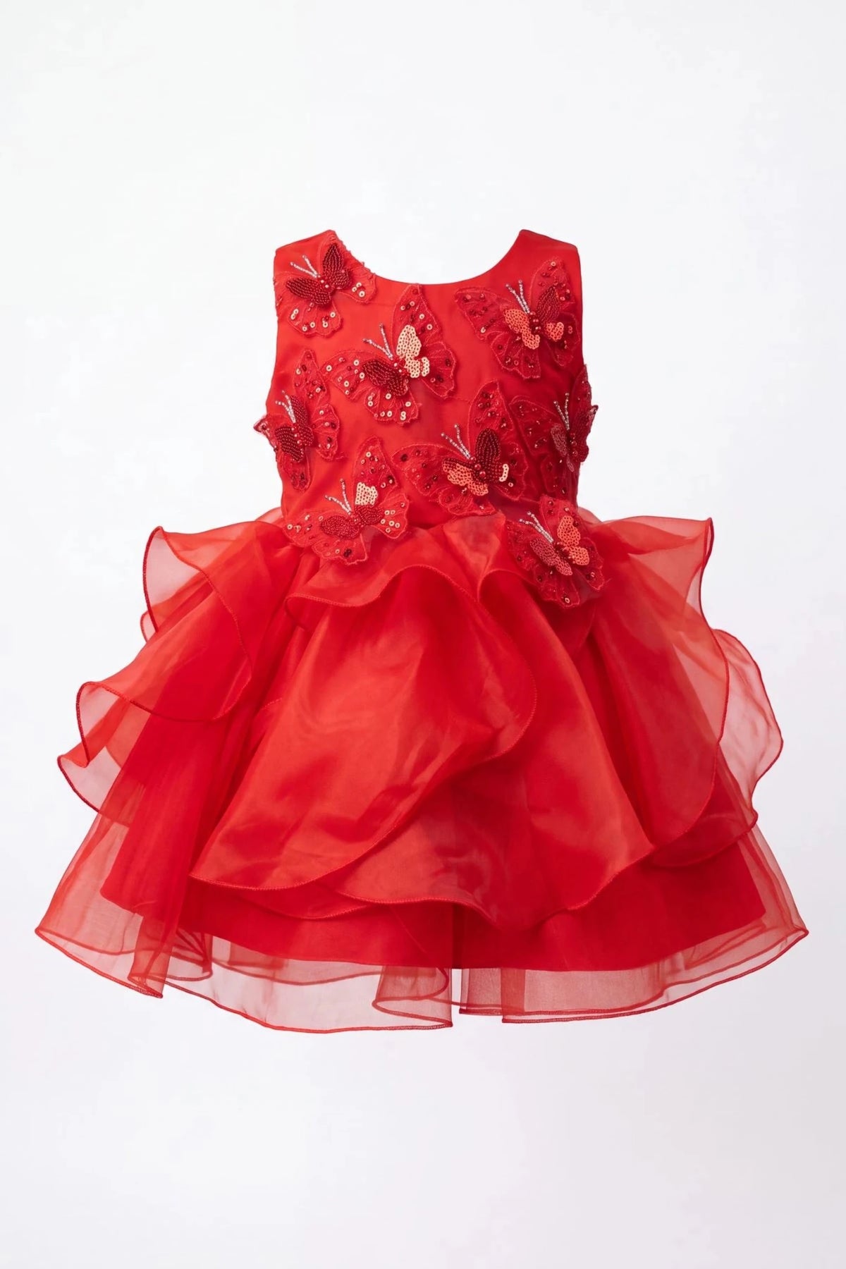 Layered shaping highlights raised butterfly appliques on the Red kids dress.
