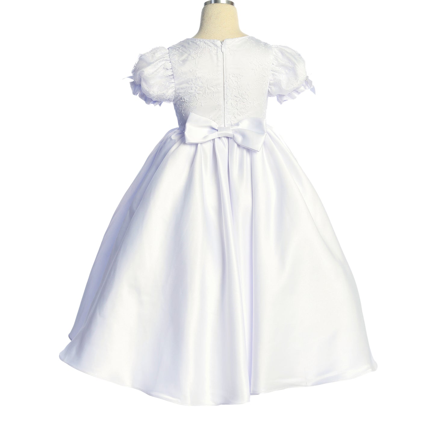 White dress with floral details on a mannequin against a white background