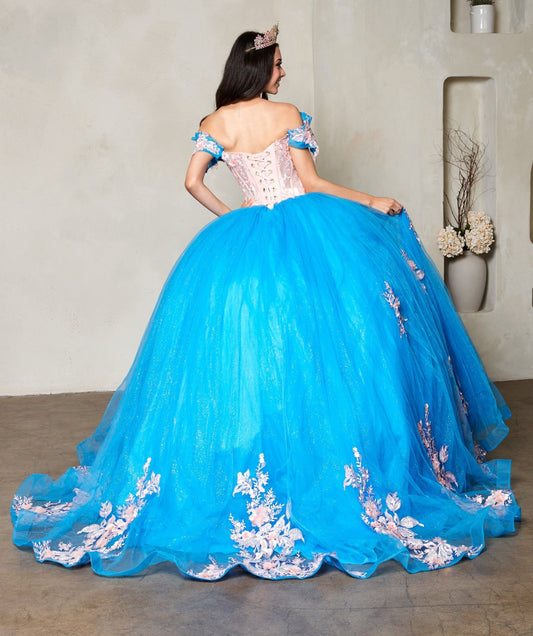 Woman back-facing in turquoise blush ball gown with lace-up corset bodice, crystal-beaded embroidery, 3D floral appliqués, and cascading full skirt