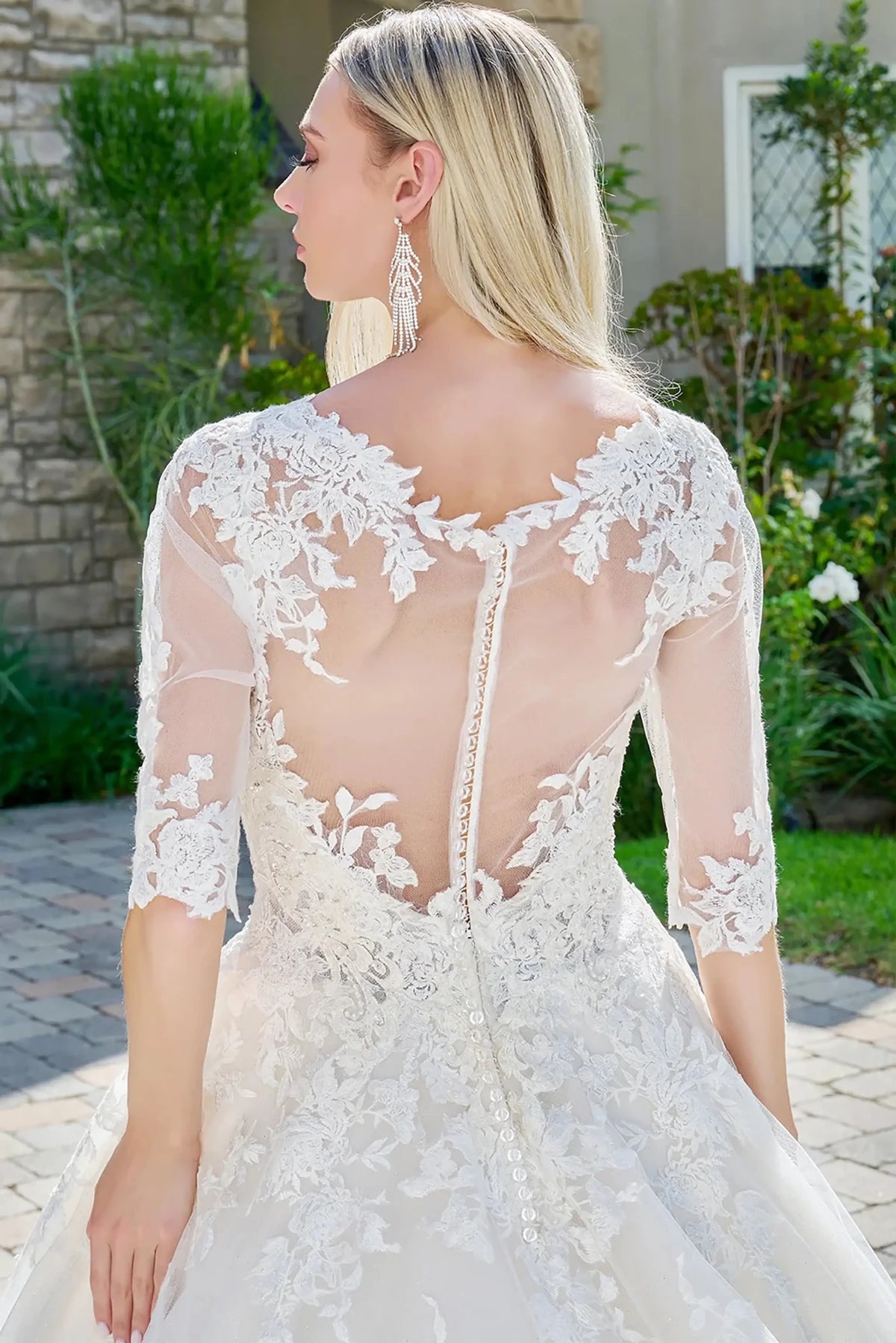Close-up view reveals Ivory Cream wedding dress with the delicate sheer rear construction.