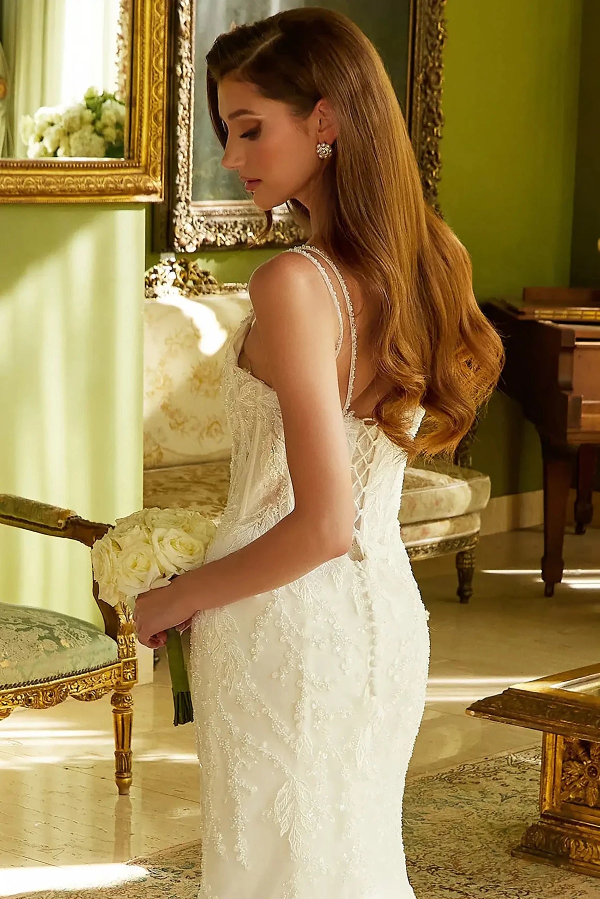 Detailed view highlights Off White wedding dress with the structured corset construction.