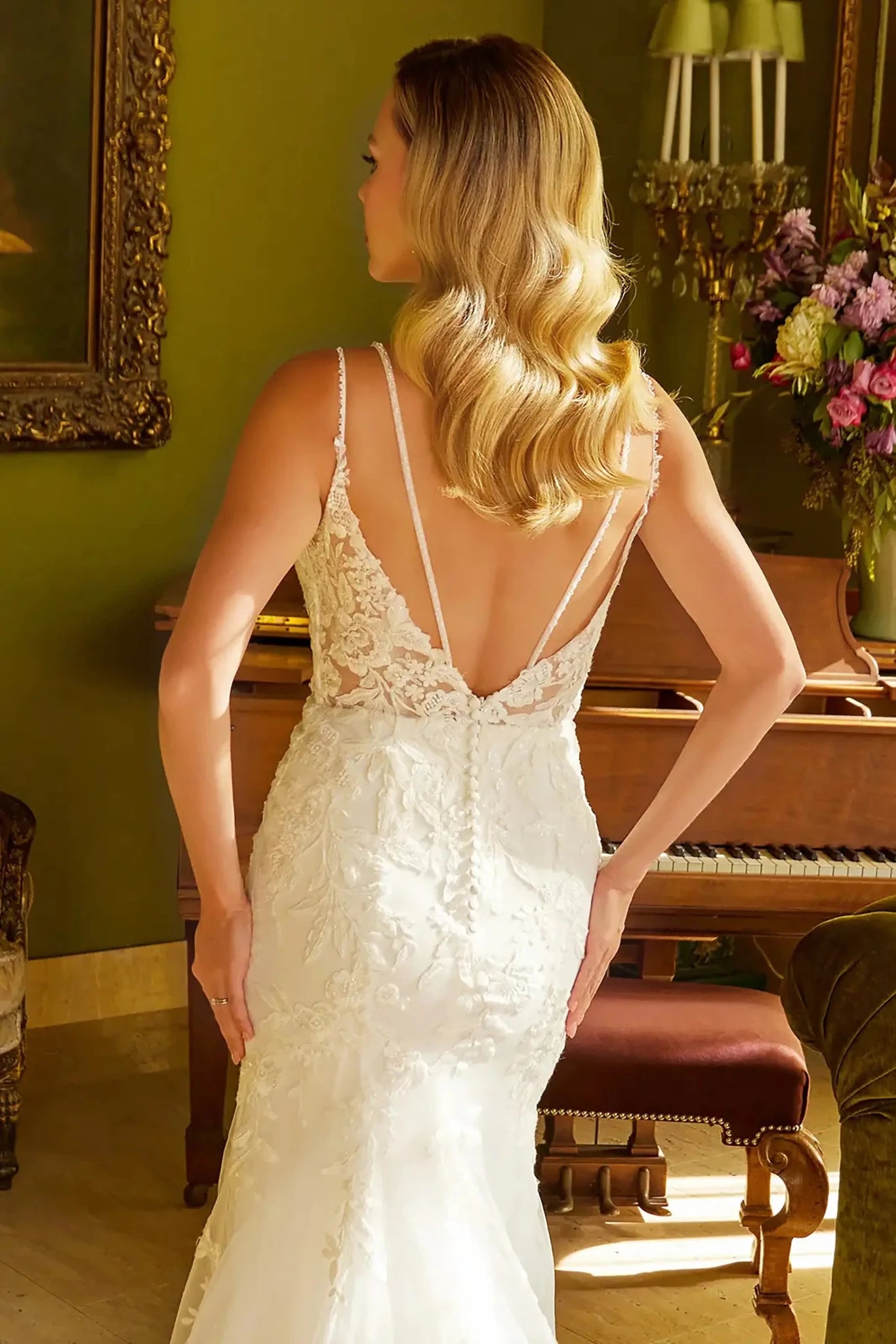 Back close-up upper view focusing on the deep V-back design, featuring a central zipper closure accented by a delicate row of decorative buttons.