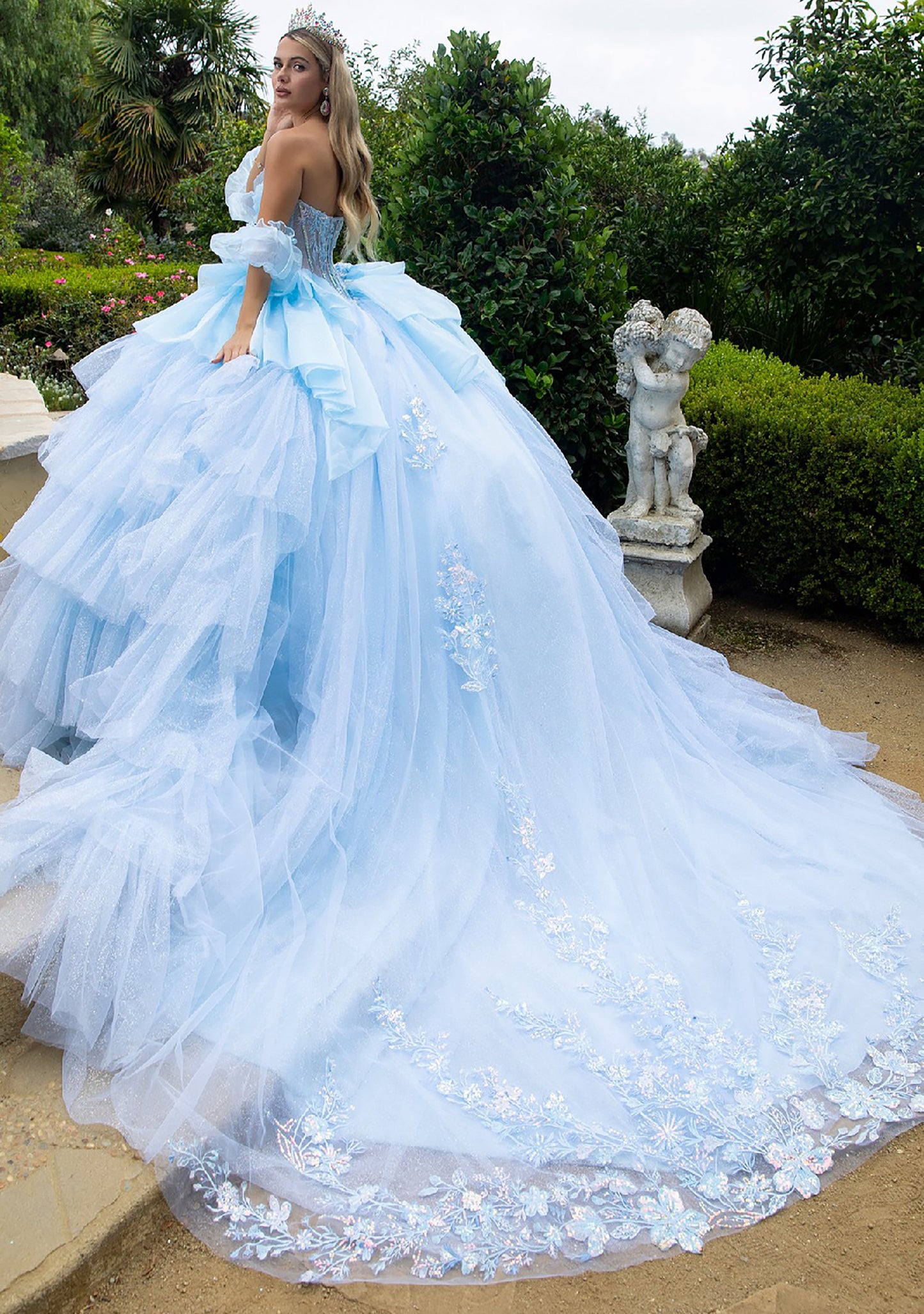 Quinceañera | Cinderella Blue Ball Gown with Detached Puff Sleeves and Ruffled Train | Eugenia dress back