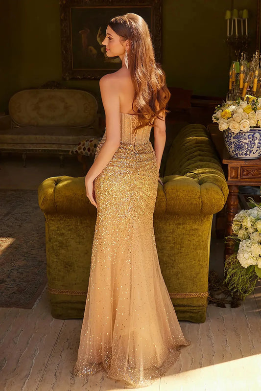 Back full-length view of of a Gold strapless beaded prom dress with v-neck corset and front slit