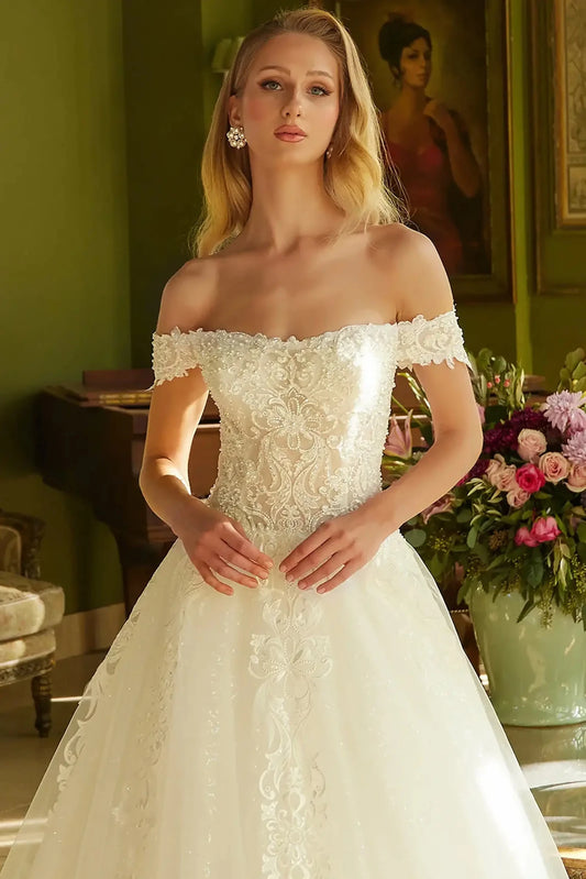 Front close-up upper view highlighting the intricate beadwork across the sweetheart bodice and the delicate texture of the off-shoulder sleeves.
