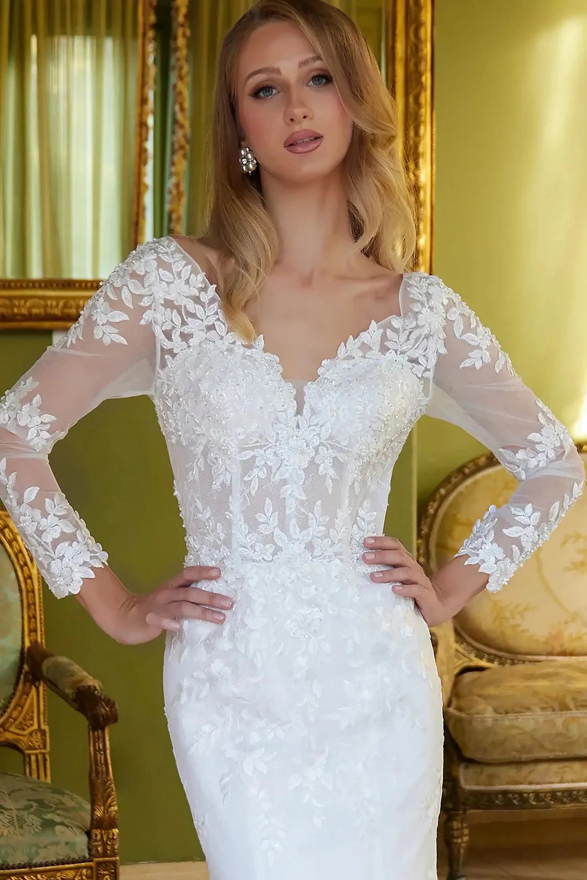 Close-up view reveals Off White wedding dress with the intricate beaded embroidery on the structured bodice.