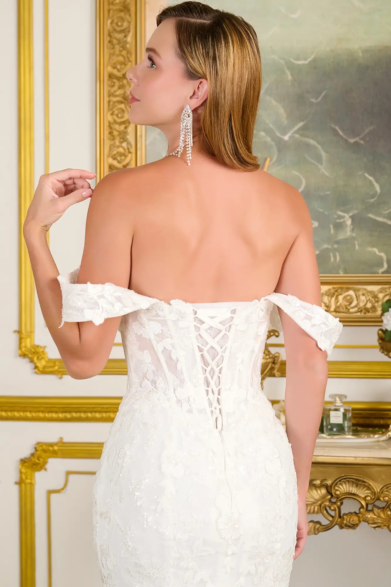 Woman showing her corset wedding gown