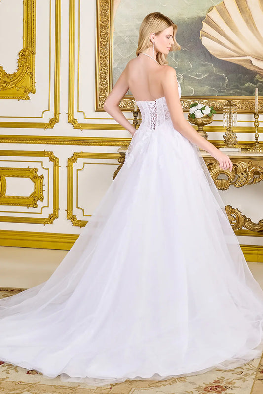 Woman in a corset style wedding gown in a elegant room