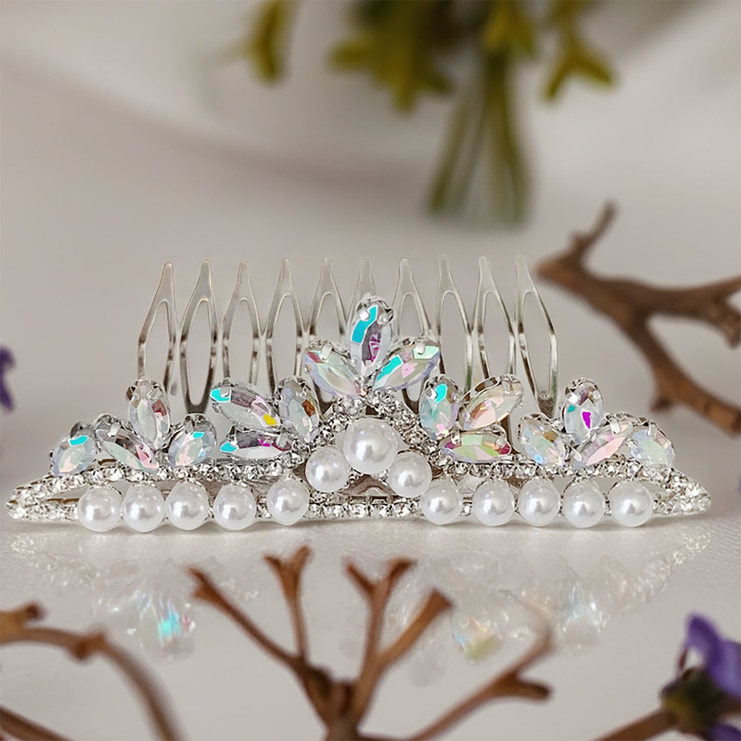 Decorative hair comb with pearls and crystals on a decorative surface