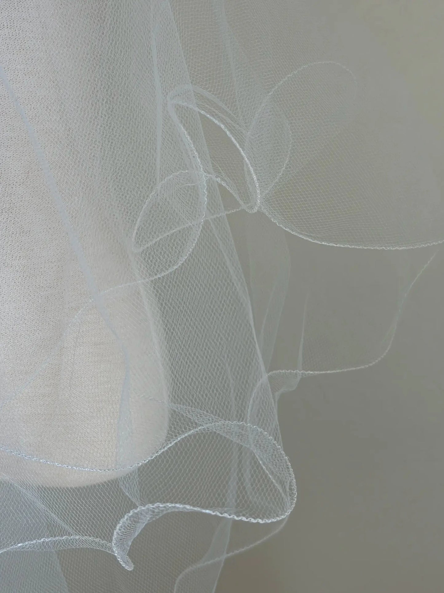Close-up of a white veil with a blurred background