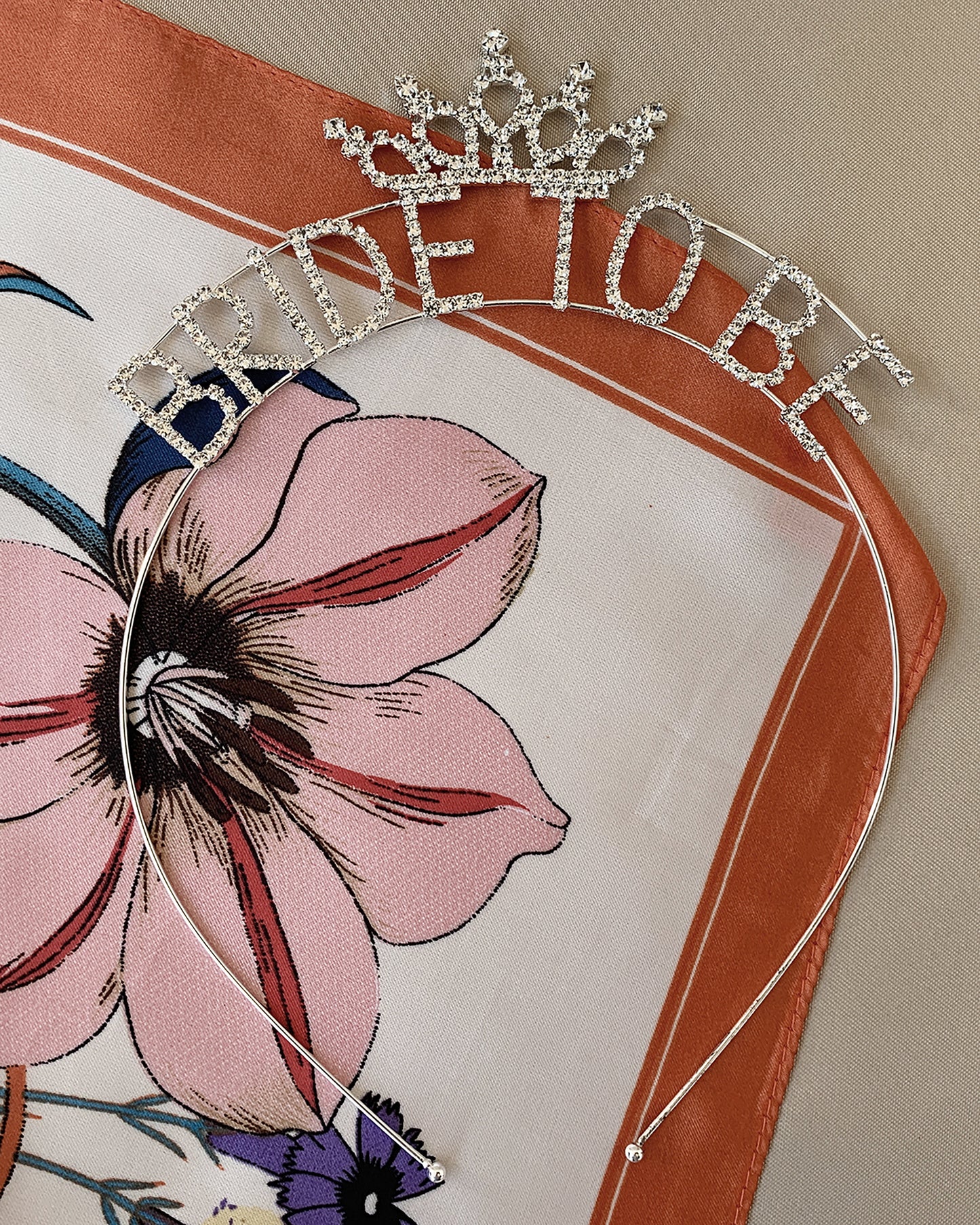 Silver tiara with 'Bride to Be' text on a headband