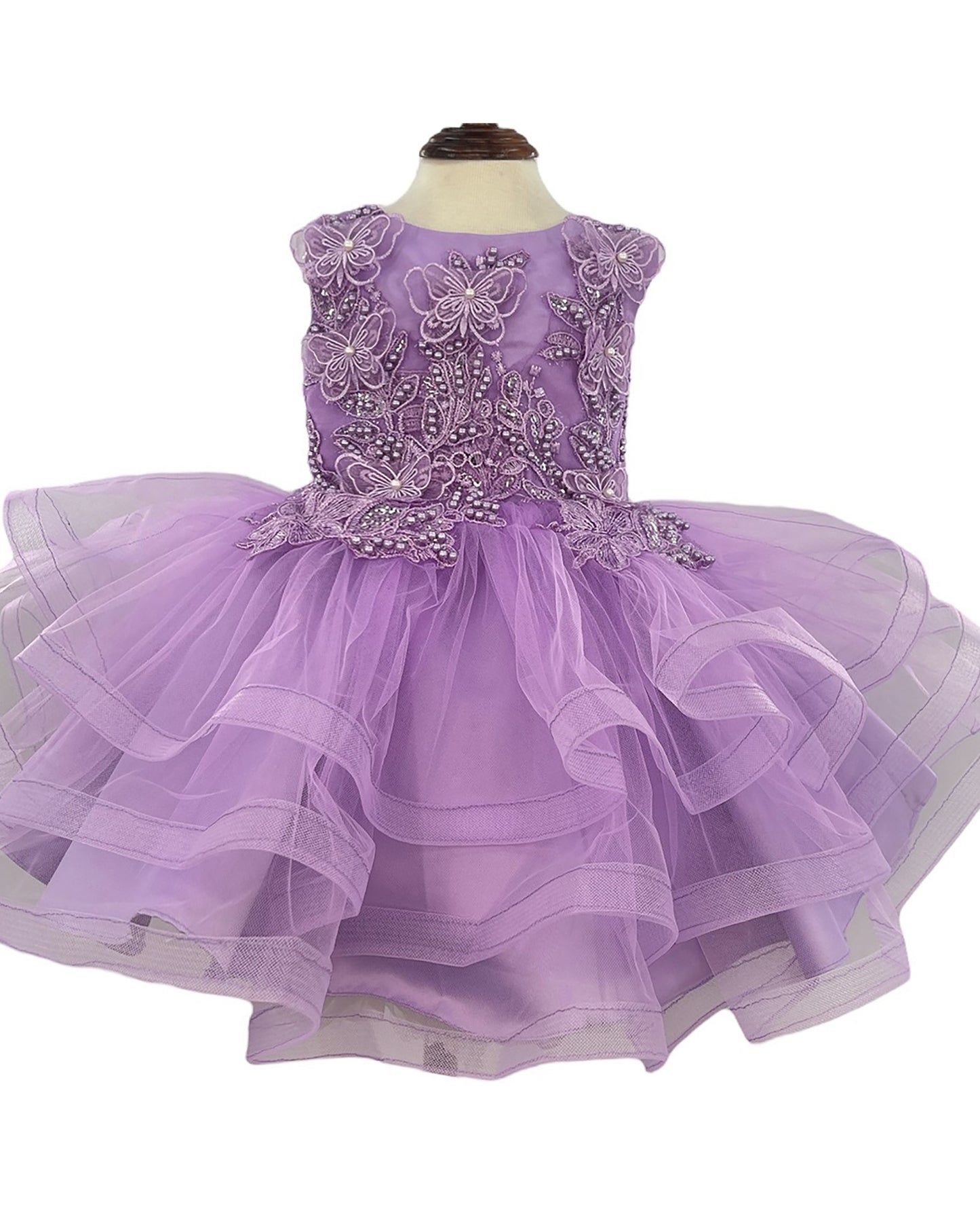 Lavender dress with floral embellishments on a white background