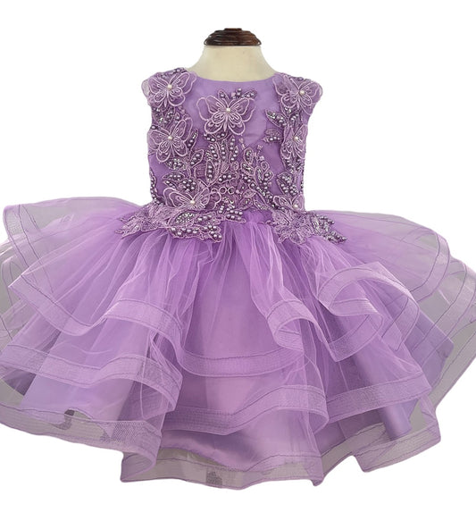 Lavender dress with floral embellishments on a mannequin against a white background