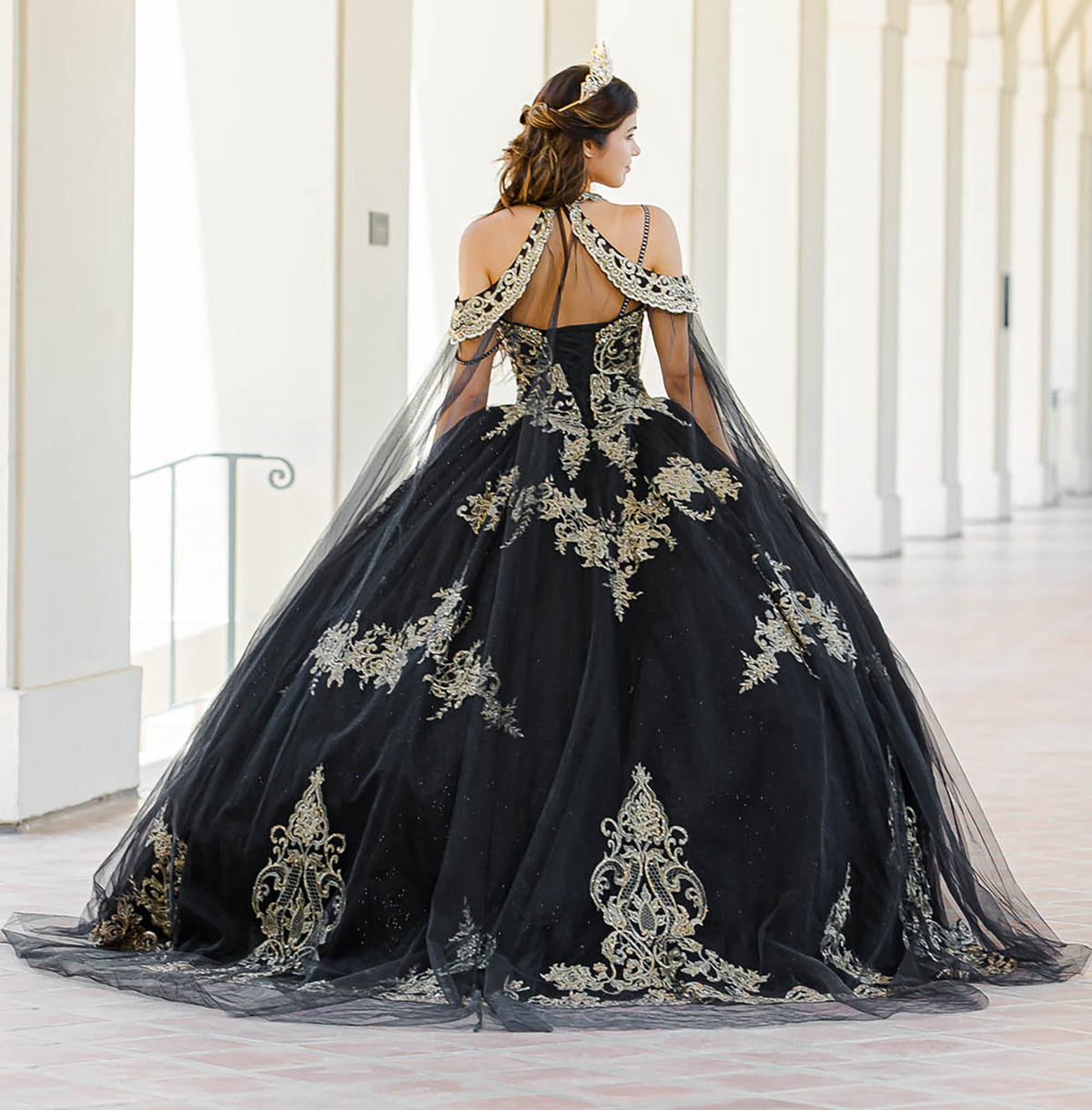 Back detail shows a black quinceañera ball gown with gold embroidery, cape and full tulle skirt.