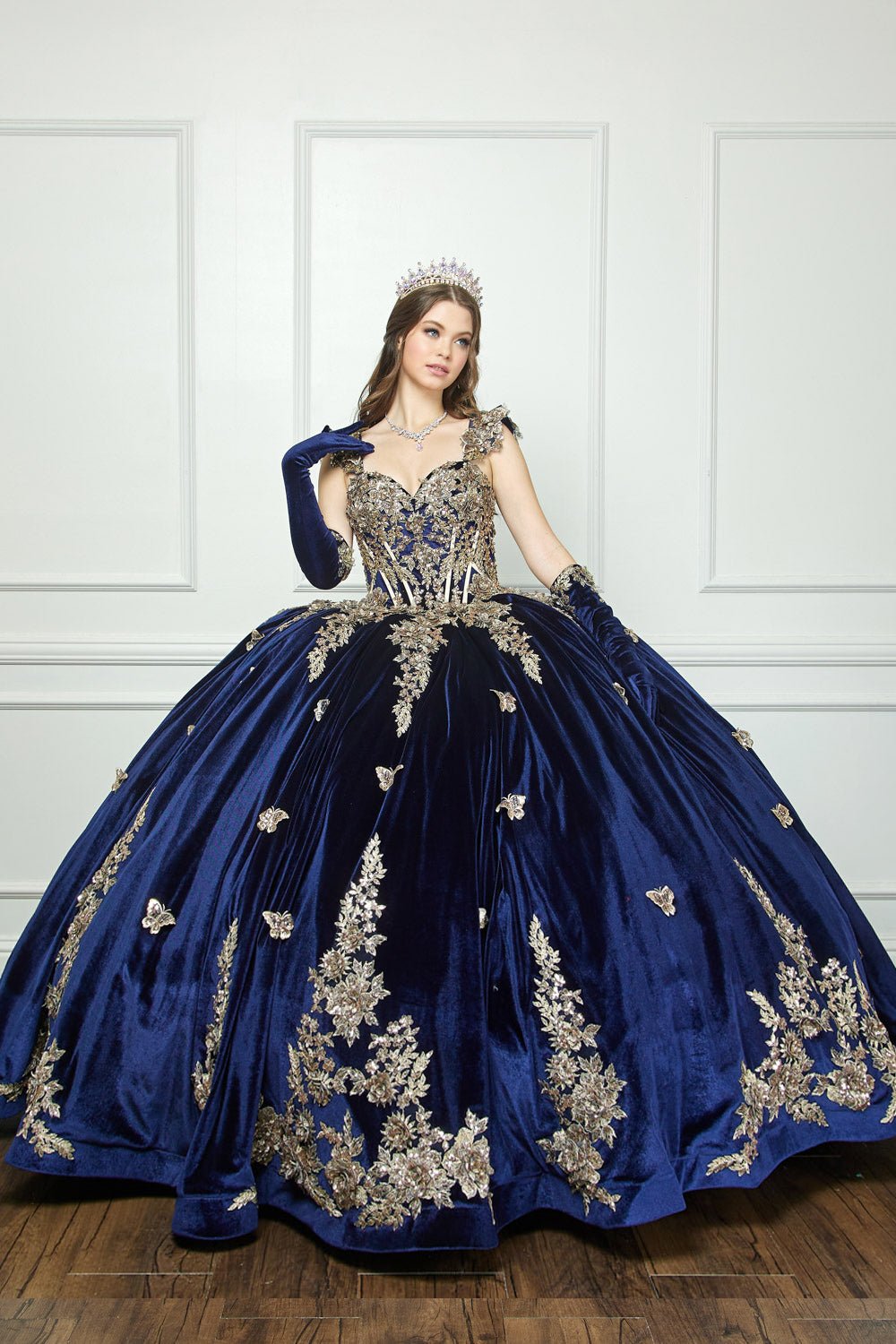 zoomed out full view of woman wearing dress and matching gloves with hand resting on shoulder